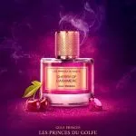 Parfum Cherry of Cashmere dans un flacon d'exception de la marque Les Fleurs du Golfe. Sur fond violet avec des cerises et des pierres précieuses à coté.